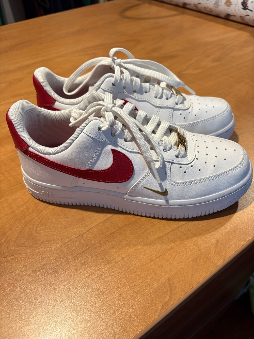 Women’s White Sneakers with Red Swoosh and Gold Accent